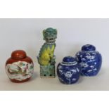 Chinese Famille Vert figure of a seated Dog of Fo on plinth base, 24cm high, two blue and white