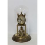 German Kieninger & Obergfell brass anniversary clock with silvered dial and glass dome, 32cm high.