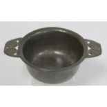 Archibald Knox for Liberty & Co. Tudric pewter porringer, the twin handles with pierced honesty seed