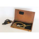 Victorian brass surveyor's protractor by Stanley in mahogany case, also a small spirit gauge. (2).