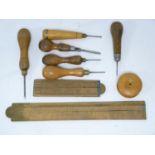 Four vintage bradawls, 2 small short tipped screw drivers, round wood string box, 2x folding rulers,