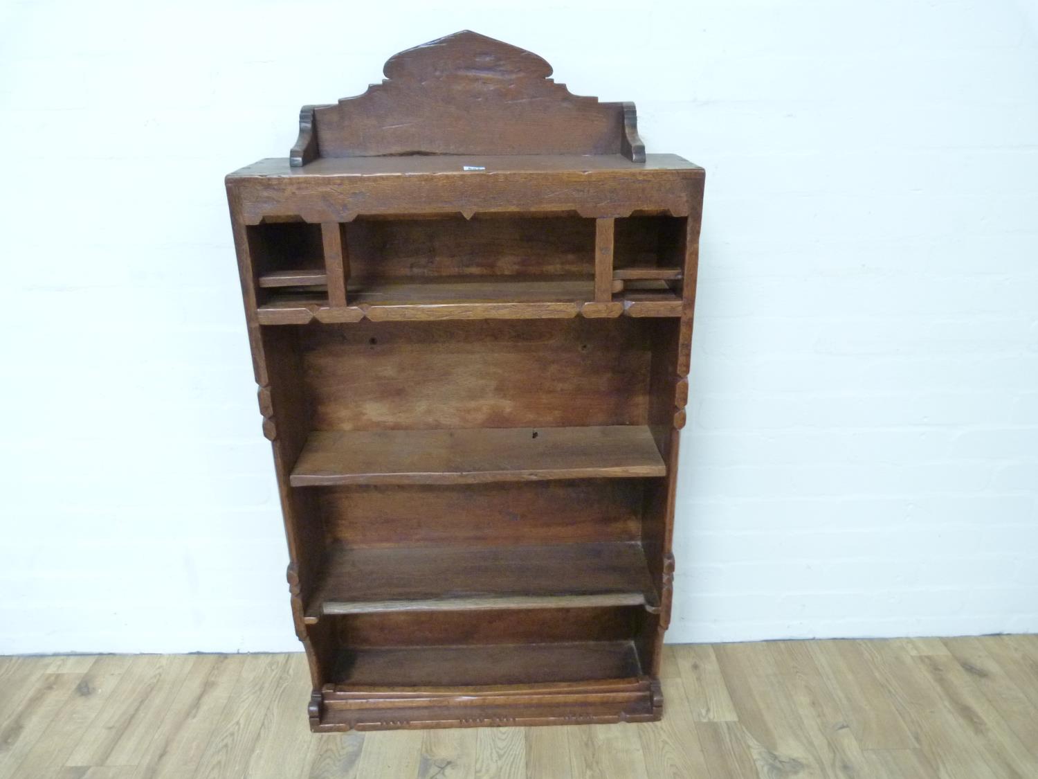 Provincial Arts & Crafts oak bookcase by Orlando Greenwood, with raised back, graduated shelves