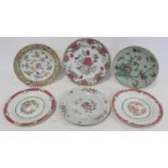 Four 18th century Chinese porcelain plates with floral decoration in the famille rose palette; a