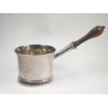 Silver brandy saucepan with flared lip, moulded foot and turned wood handle by Walter Brind 1872.