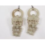 Pair of Chinese mutton fat jade earrings, each with a double drop, delicately carved, dependant from