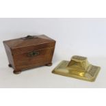 19th Century mahogany tea caddy of sarcophagus form, 21cm wide, unfitted interior, also a brass desk