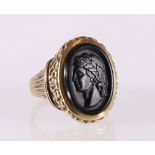 Gent's 9ct yellow gold ring set with portrait of a Greek or Roman laureate bust, ring size S, 8.7g