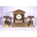 French clock garniture set of architectural form decorated with classical battle scene and eagle