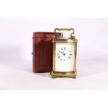 French carriage clock in serpentine case with further leather carrying case, 16cm tall