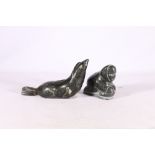 Canada Eskimo Art carving of a figure sledging and another of a seal, (2)