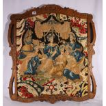 Antique needlework panel within ornate carved wood frame, 80cm x 72cm