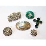 Plantagenet nickel and bluster pearl oval brooch and five old paste brooches, leather case.