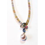 White gold pendant with four coloured sapphires, a pearl and tiny diamonds, on similar faceted