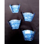 Set of four 19th century Staffordshire blue and white asparagus servers, each decorated with a