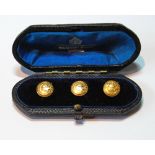 Set of three 18ct gold studs, engraved with garters, 1877, cased, 4.4g.