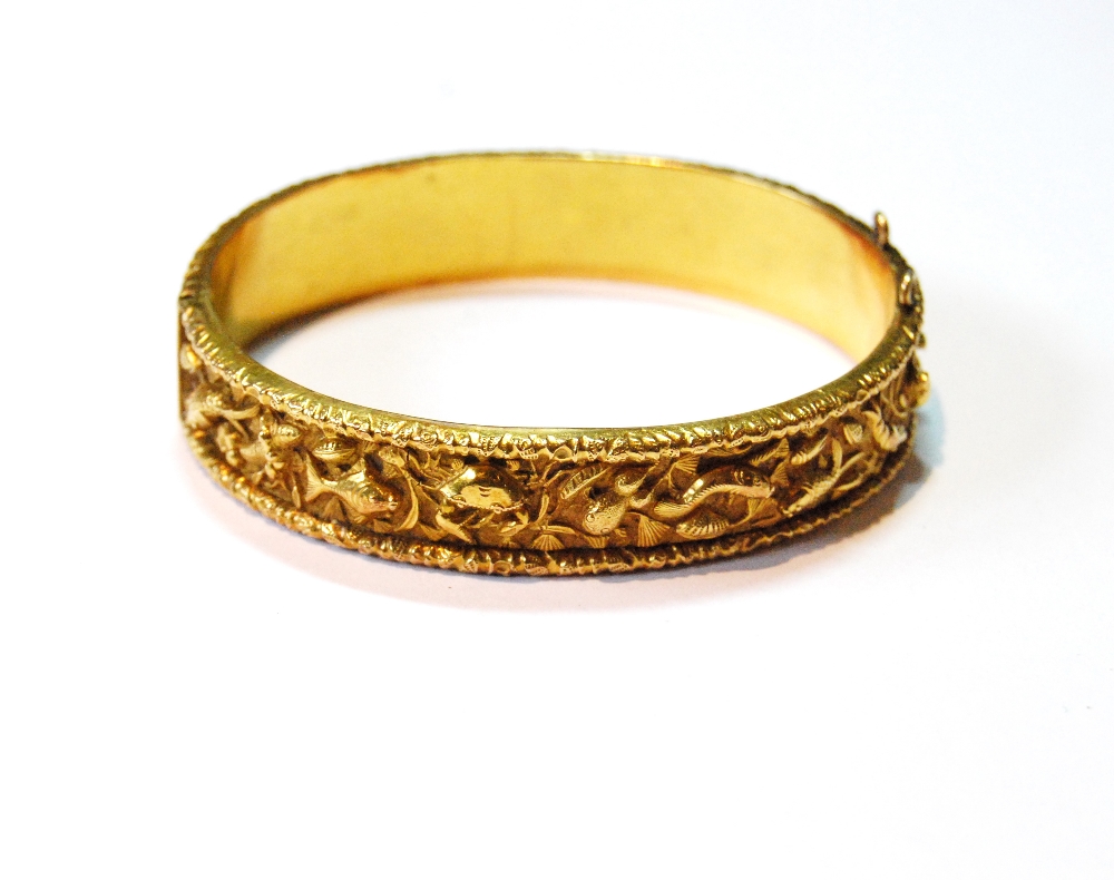 Chinese gold hinged bangle embossed with typical characters, W.H., 20', 34g.
