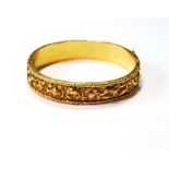 Chinese gold hinged bangle embossed with typical characters, W.H., 20', 34g.