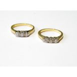 Two diamond three-stone rings in 18ct gold, sizes L and N.