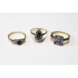 Diamond and sapphire marquise cluster ring, another, pale blue, and a similar smaller ring, all