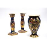 Pair of Wiltshaw & Robinson Carlton Ware lustre candlesticks with blue glaze with gilt chinoiserie