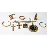 Two gold coin mounts, two charms, a band ring, two crosses and various items, all 9ct, 22.5g gross.