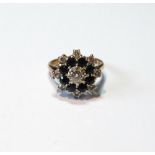 Cluster ring with diamond brilliant and eight sapphires within eight further brilliants, in 9ct