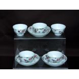 Five 18th century Chinese tea bowls with three saucers to match, each decorated with flower and