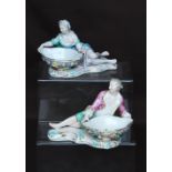 Pair of Meissen sweetmeat dishes in the form of reclining male and female figures in 18th century