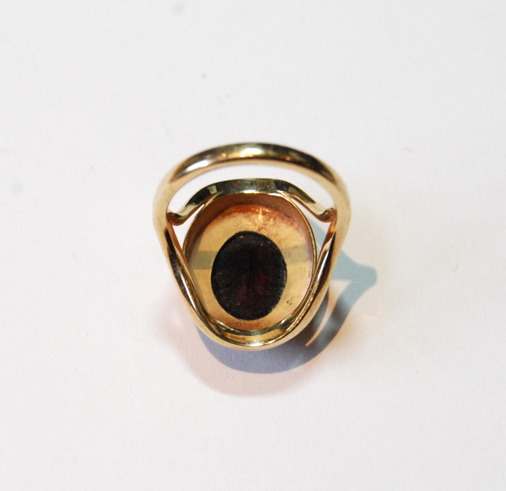 Dress ring with oval garnet on textured band, 9ct gold, 1974, size L. - Image 3 of 3