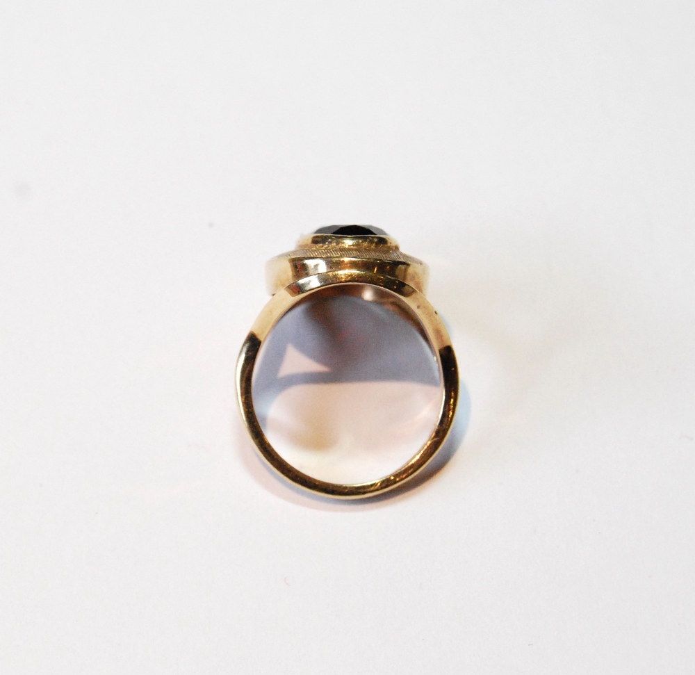 Dress ring with oval garnet on textured band, 9ct gold, 1974, size L. - Image 2 of 3