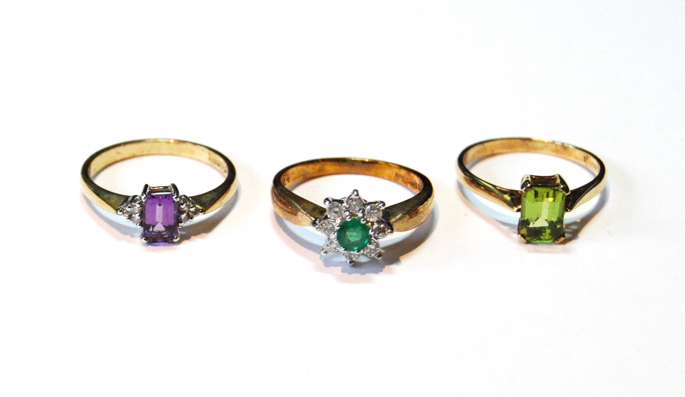 Diamond and emerald daisy cluster ring, another, amethyst, and another, peridot, sizes M/N.   (3)