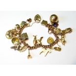 Gold curb bracelet, '9c', with various charms, 56g.