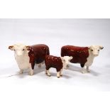 Beswick Hereford bull, heifer and calf, 'Ch. of Champions'.  (3)