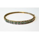 9ct gold hinged bangle with diamonds and emeralds, 12.5g.