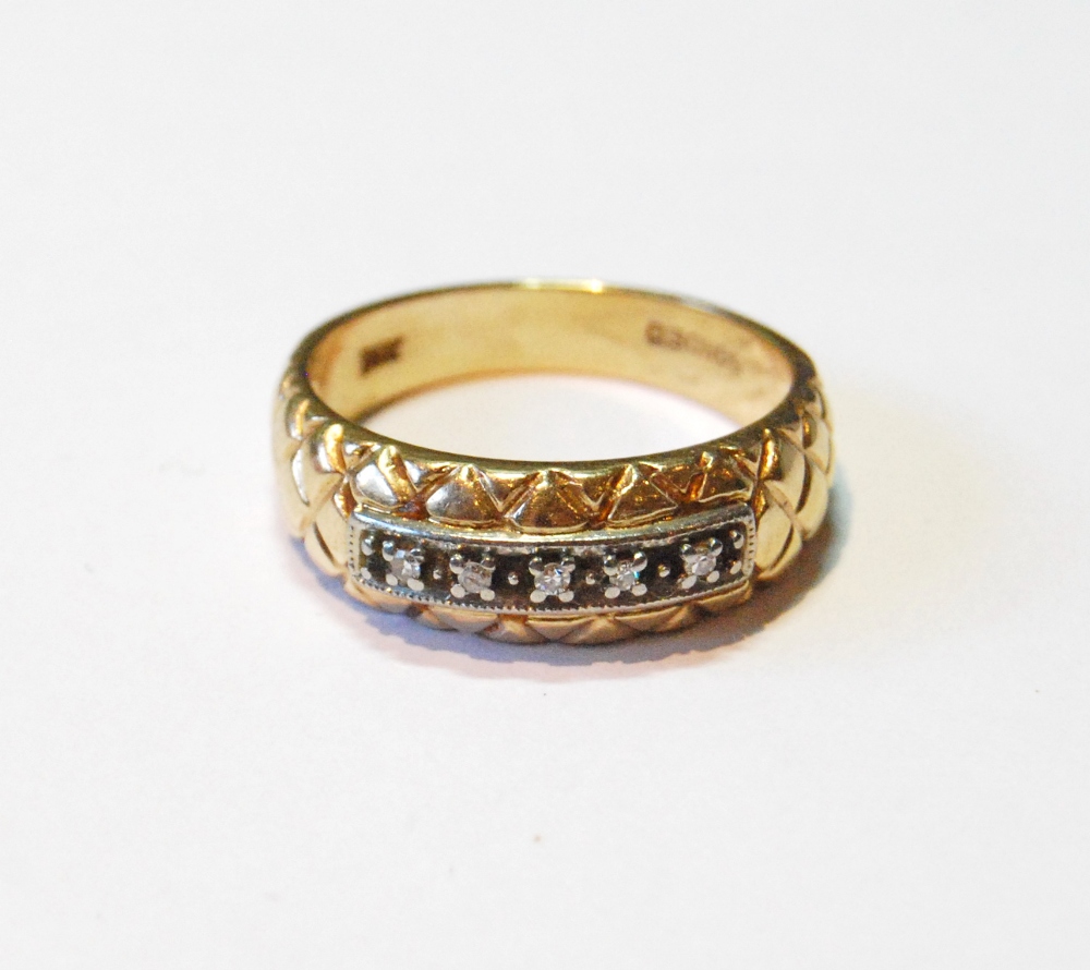 Gold ring with five diamond brilliants upon a lattice, '14k', size T, 5.7g.