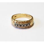 Gold ring with five diamond brilliants upon a lattice, '14k', size T, 5.7g.