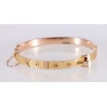 9ct yellow gold bangle of buckle and belt form, stamped 375 to closure, 8.3g gross