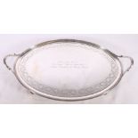 George III silver twin-handled tray with chased ivy band raised on four slender scroll supports,