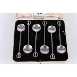 Set of six contemporary hammered white metal coffee spoons with clef finials, unhallmarked but