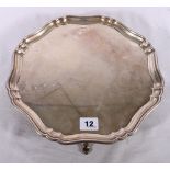 Art Deco period silver salver with piecrust border raised on four pad feet by Stevenson and Law