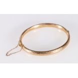 9ct hollow gold bangle with textured hammered effect decoration by Deakin and Francis, 7.9g