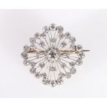 Unhallmarked diamond set combination pendant brooch, the central diamond approximately 0.4ct,