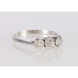 Platinum diamond three-stone ring, the central diamond approximately 0.3ct flanked by two 0.25ct