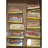 Ten Dinky Toys diecast model vehicles including 131 Jaguar E Type 2+2, 164 mk4 Ford Zodiac, 188