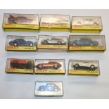 Ten Dinky Toys diecast vehicles including 129 Volkswagen 1300 Sedan, 131 Jaguar E Type 2+2, 132 Ford