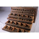An eight drawer toolmakers chest containing raw materials, hex bar, round bar, tube, taps, dies,