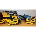 Seven Tonka toys including crane, excavator, truck etc.