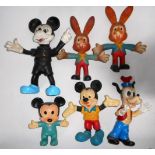 Collection of sponge and soft plastic Mickey mouse and other figures.