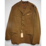 British Army dress uniform khaki green uniform having George V brass Royal Army Service Corps