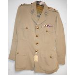 British Army dress uniform jacket having RTC (Royal Tank Corps) brass buttons by Pitt and Co of
